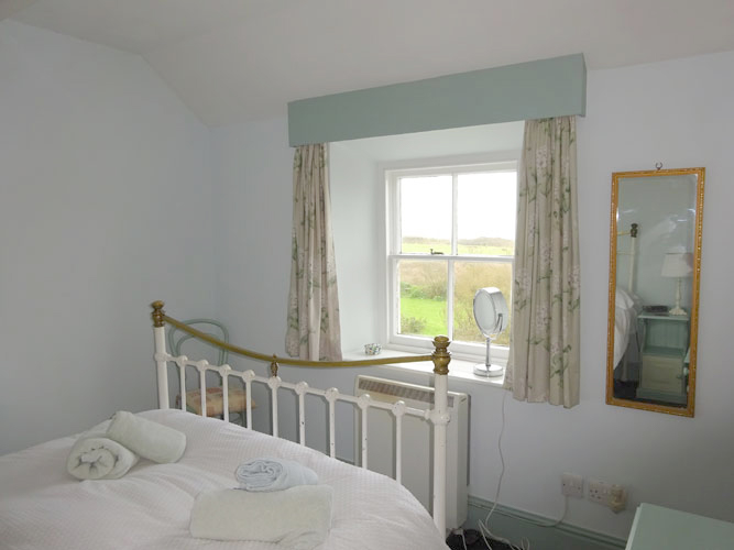 Double bedroom window in Treeve Moor Cottage